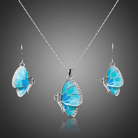 Delicate silver butterfly necklace and earrings set with turquoise enamel wings, rhinestones – symbol of transformation
