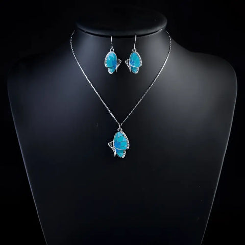 Silver butterfly necklace with turquoise gemstone and matching earrings set