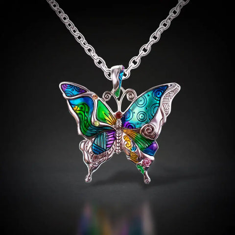 Vibrant butterfly pendant necklace with iridescent enamel wings, symbol of transformation