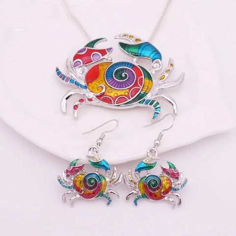 Vibrant enamel crab necklace and earrings set in silver, ocean conservation symbol