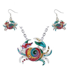 Vibrant enamel crab necklace and earrings set in silver accents, ocean conservation symbol