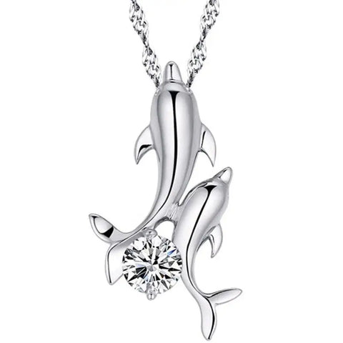 Silver dolphin pendant necklace with gemstone center, symbol of love and ocean harmony