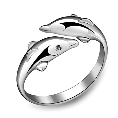 Silver dolphin ring with gemstone eye, polished finish, symbol of protection
