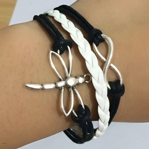 Silver dragonfly charm bracelet with black white braided leather cords