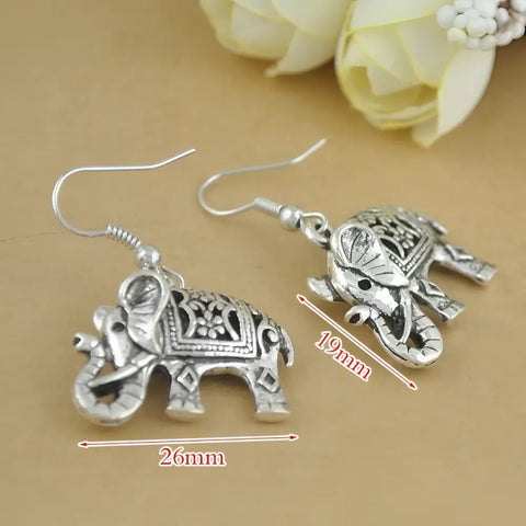 Silver elephant dangle earrings with engraved patterns, vintage finish