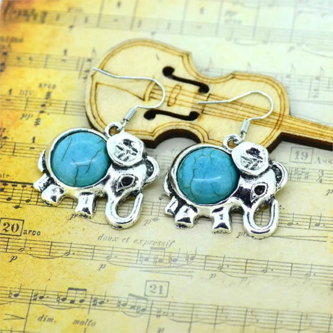 Silver elephant earrings with turquoise inlays, symbol of protection