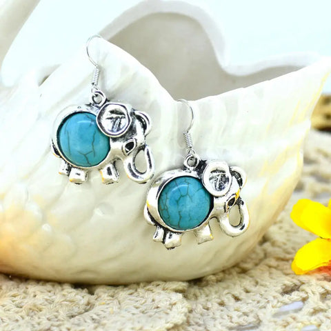 Silver elephant earrings with turquoise inlays, symbol of protection