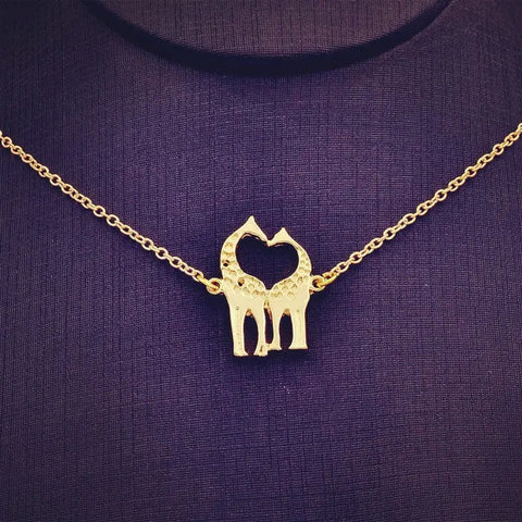Gold-toned Giraffe Necklace with cat heart pendant symbolizing love