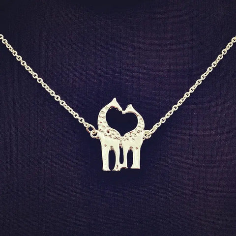 Giraffe necklace with heart pendant of two giraffes and sparkling stones