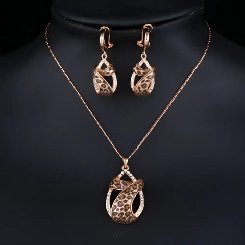 Rose gold leopard print pendant necklace with crystal accents and earrings