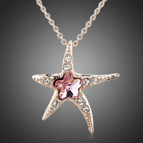 Delicate silver starfish necklace with pink crystal center by Helping Animals At Risk