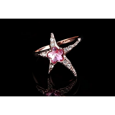 Rose gold starfish ring with pink crystal center and clear crystals, ocean beauty protection