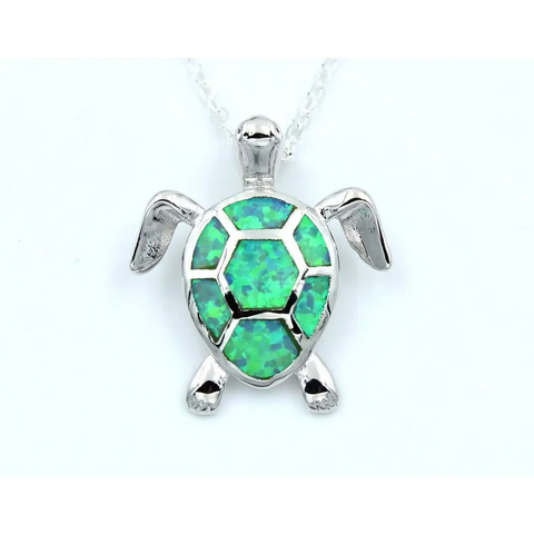 Silver turtle pendant with vibrant green opal shell inlay, protection symbol