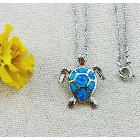 Silver turtle necklace with blue opal shell inlay, symbol of protection
