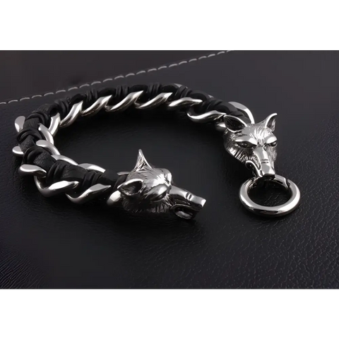 Wolf bracelet with silver wolf-head, black braided cord, twisted metal links