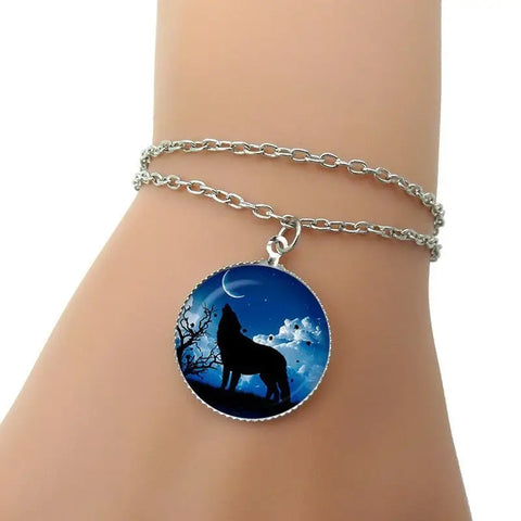 Silver wolf silhouette bracelet with starry blue glass pendant