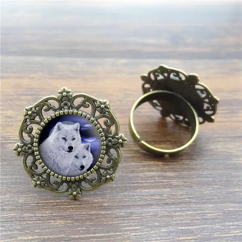 Antique brass filigree Wolf Ring with wolves inset, symbol of protection
