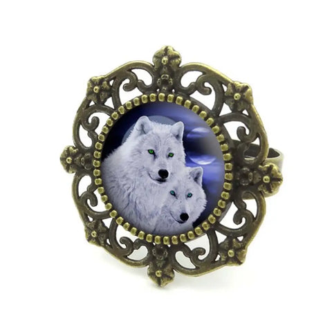 Antique brass filigree Wolf Ring with moonlit wolves glass inset